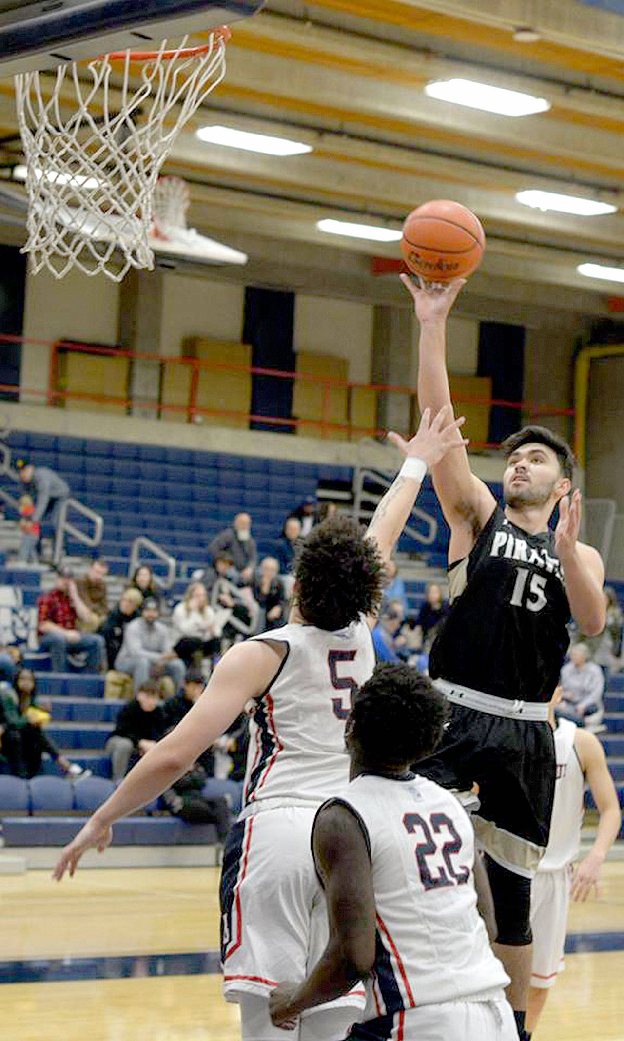 Rick Ross Samuel Kahapea shoots against Bellevue College. Kahapea scored 18 points to help the Pirates come from behind to beat Bellevue 69-68, qualifying for the NWAC Tournament.