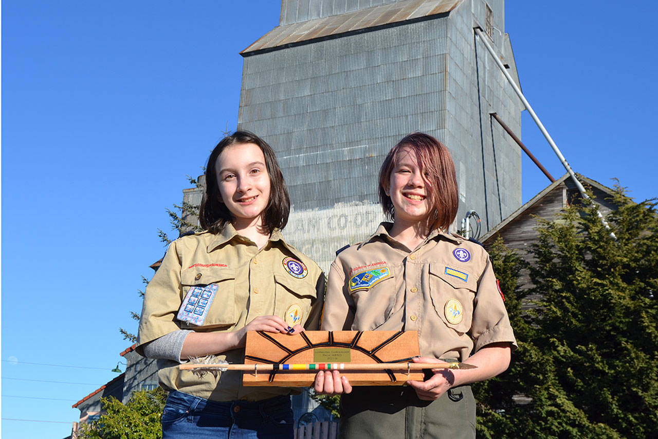 Fifth-graders Lindsey Anderson, left, and Loralynn Chrisinger recently became the first girls on the Olympic Peninsula to earn Cub Scouts’ highest rank, the Arrow of Light. They plan to join BSA Scout, formerly Boy Scouts, troops in Sequim and Port Angeles soon. Sequim Gazette photo by Matthew Nash