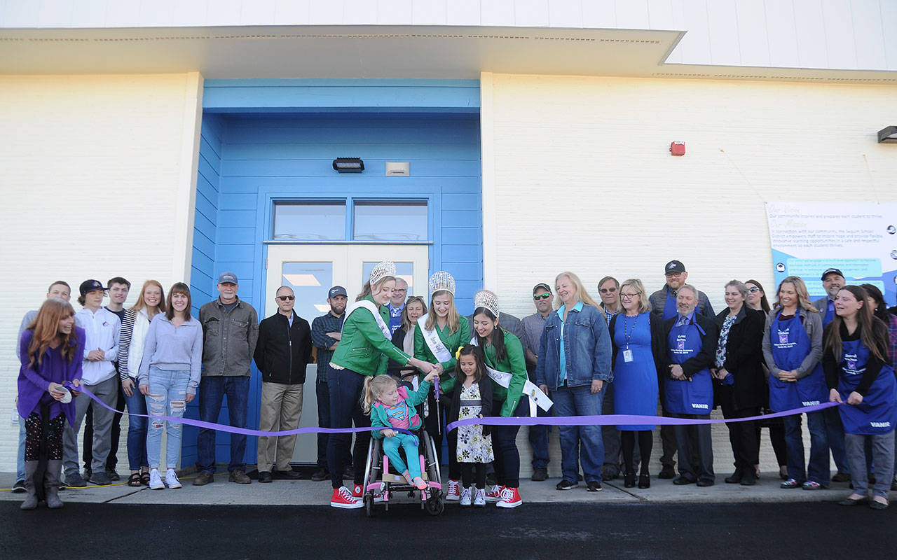 School representatives, community members and others celebrate the official opening of the Sequim School District’s new central kitchen with a ribbon-cutting event on March 26. Sequim Gazette photo by Michael Dashiell