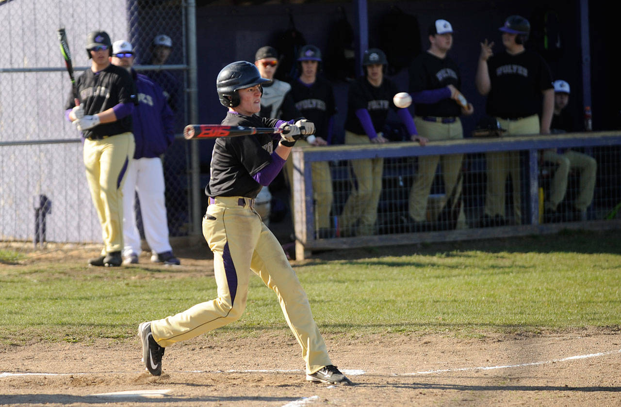Sequim’s Joey Oliver rips a base hit off Crosspoint starter Gage Broderson in the first inning in the Wolves’ 11-1 win on March 26. Oliver was 2-for-3 with an RBI and two runs scored. Sequim Gazette photo by Michael Dashiell