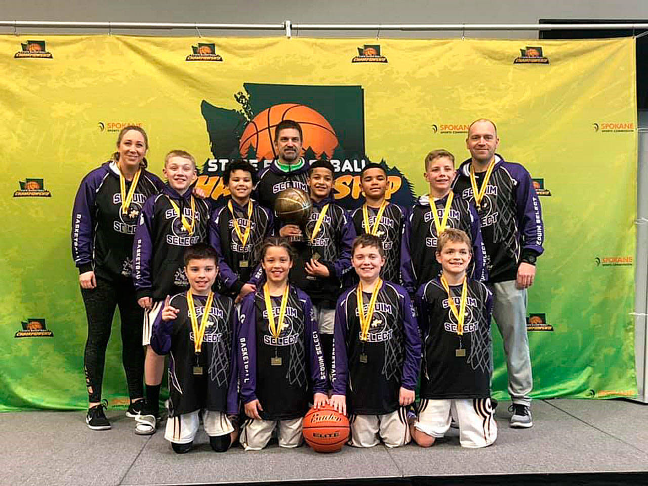Sequim’s fifth grade select AAU boys basketball team members include (back row, from left) head coach Nikki Julmist, Devyn Dearinger, Legend Liggins, assistant coach Gary Abrams, Solomon Sheppard, Jericho Julmist, Hunter Tennell and assistant coach Brent Schmadeke, with (front row, from left) Adrian Aragon, Alijah Brown, Clay Abrams and Zeke Schmadeke. Not pictured is Lincoln Bear. Submitted photo