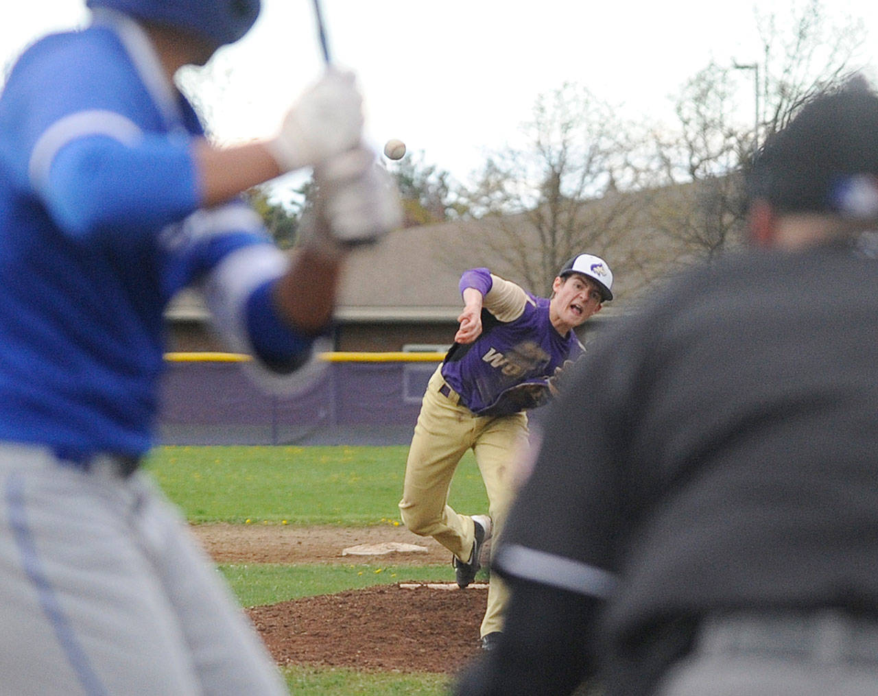 Sequim’s Joey Oliver pitches two innings of relief against Olympic on April 12. The Wolves won in six innings, 13-3. Sequim Gazette photo by Michael Dashiell