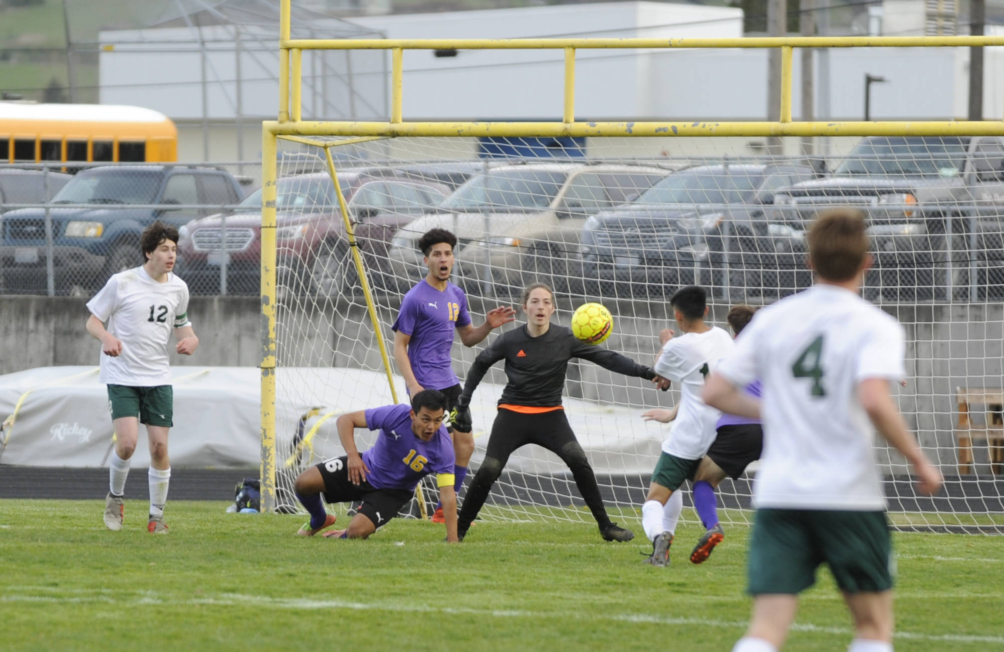 Sequim defenders Rudy Franco (16) and Brandon Benson (12) and goalkeeper Navy Thomas-Brenske defend the Wolves’ goal in the first half of a 1-0 Sequim win over rival Port Angeles on April 9. Sequim Gazette photo by Michael Dashiell