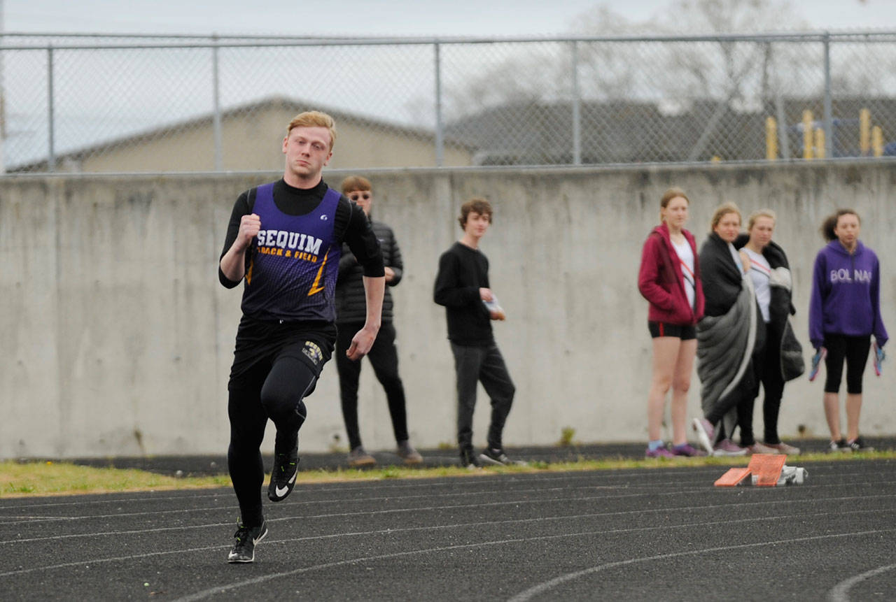 Sequim’s Logan Laxson breaks from the starting line to place first in the 400-meter race in Sequim on April 11. Sequim Gazette photo by Michael Dashiell