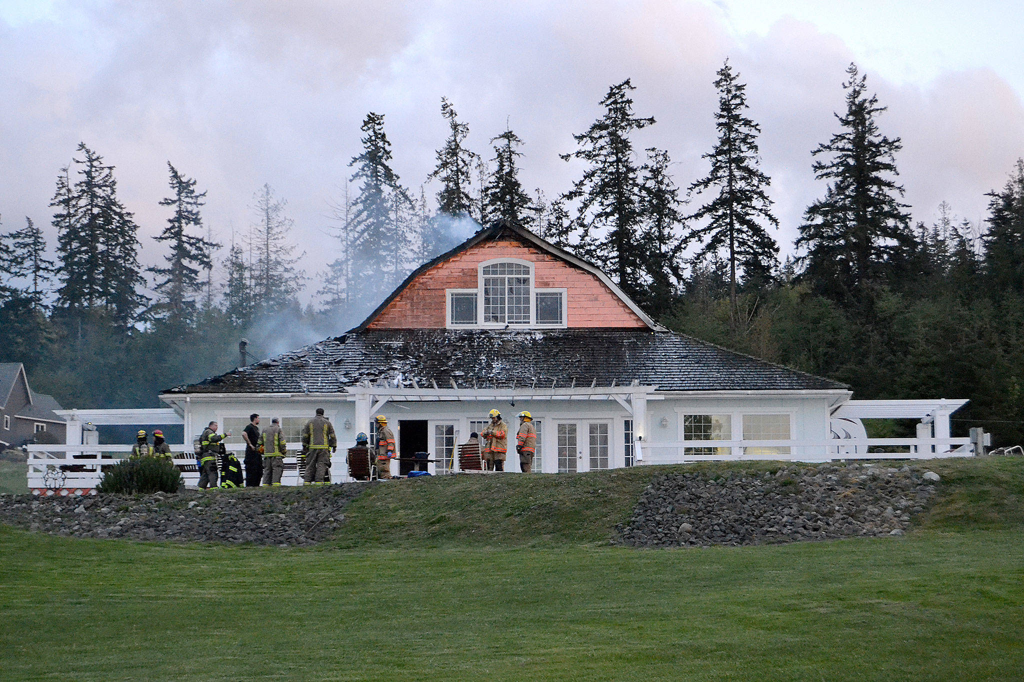 A cause for the fire in this Gardiner home remains under investigation, says fire officials with Clallam County Fire District 3. When fire crews responded on April 26, the attic was fully involved in flames. Sequim Gazette photo by Matthew Nash