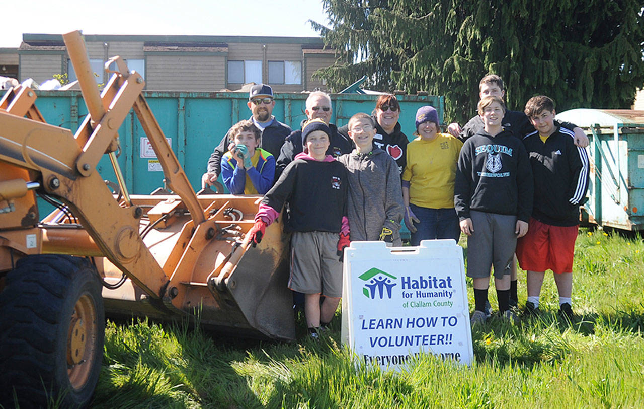 Boy Scout Troop 90 partners with Habitat for Humanity of Clallam County at the April 27 Rally in the Alley, helping city residents dispose of unwanted items. Pictured are (back row, from left) adult helpers Mike Pinell, troop leader Rene Nadon, Habitat executive director Colleen Robinson and Stacy Halverson, with Scout Joe Pinell, along with (front row, from left) Scouts A.J. Piererra, Zack Pinell, Hunter Halverson, Aaron Wallen and Shane Tenneson. Not pictured are Scouts Beau Halverson and Dean Rynearson and adult volunteer Paul Rynearson. “This is one (event) all the Scouts want to come out for,” Nadon said. “Troop 90 has been here for all of them,” Robinson said. Sequim Gazette photo by Michael Dashiell