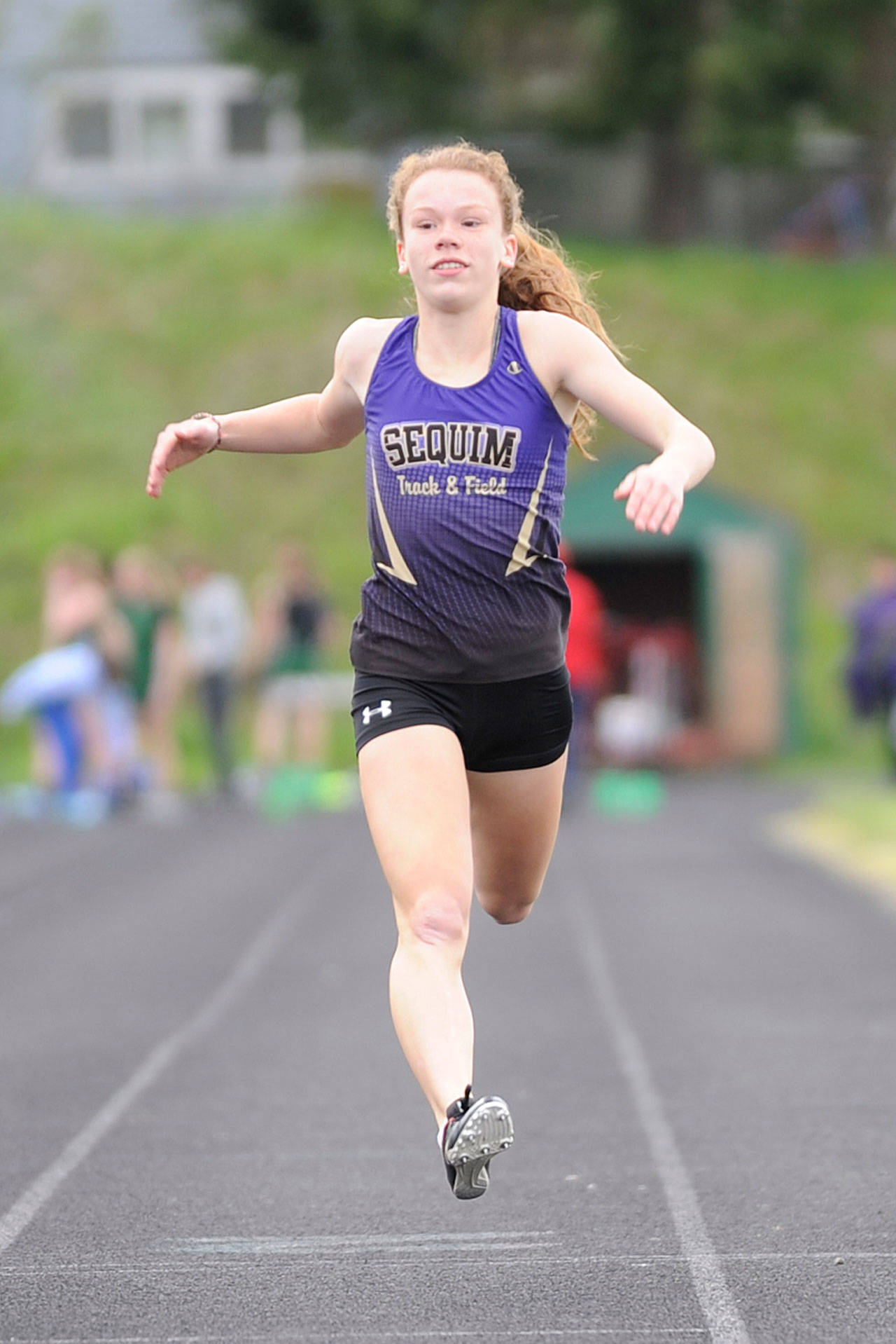 Sequim’s Riley Pyeatt competes in the 100-meter dash in an Olympic League double dual meet in Port Angeles on April 25. The freshman and other Wolves look for district meet berths at the Olympic League championships set for May 9 and May 11 at North Kitsap High School in Poulsbo. Sequim Gazette file photo by Michael Dashiell