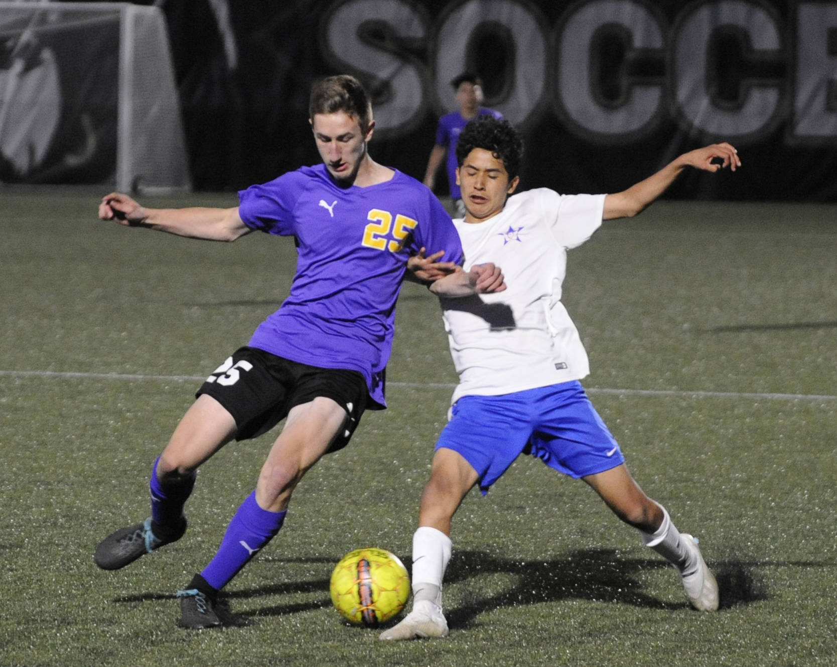 Sequim’s Brandon Wagner, left, and David Baltazar of Washington battle for control in the second half of Sequim’s 4-2 district playoff win on May 7. Sequim Gazette photo by Michael Dashiell