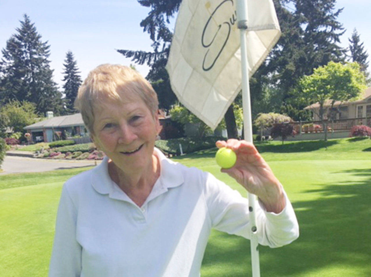 Long-time club member Linda Collet celebrates a hole-in-one at Sunland Golf and Country Club on May 9. Collet aced the No. 5 hole at Sunland, driving the 106 yards from the silver tees. Submitted photo