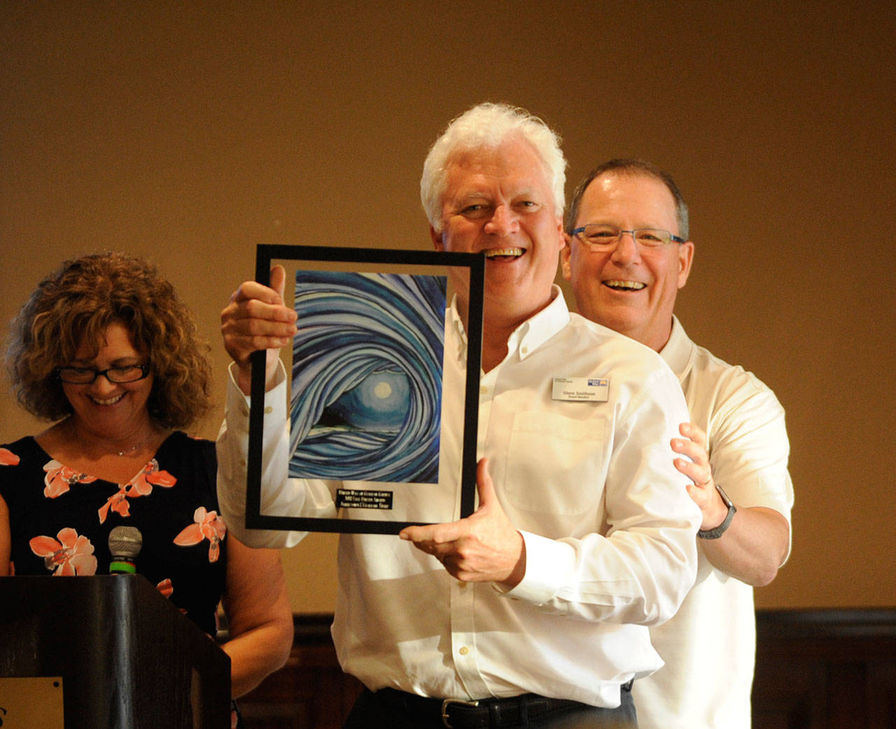 Glenn Smithson, 7 Cedars Casino General Manager, accepts a United Way of Clallam County award at the organization’s annual Campaign Celebration at The Cedars at Dungeness on May 9. Presenting the award are 2018 campaign chair Lori Taylor and board member/2017 campaign chair Chris Szczepczynski. Sequim Gazette photo by Michael Dashiell