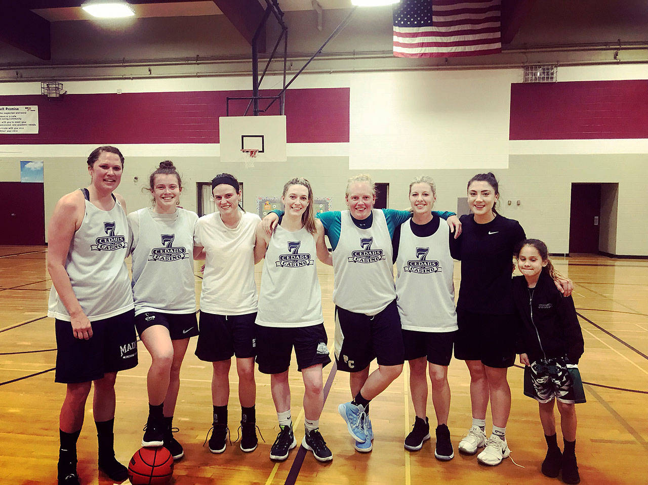Members of the winning squad from 7 Cedars Casino celebrate a win in the Port Angeles Parks & Recreation women’s basketball league on May 15. After splitting the first two of the best-of-three series, 7 Cedars Casino routed Elwha 80-58 in the decisive third game. Submitted photo