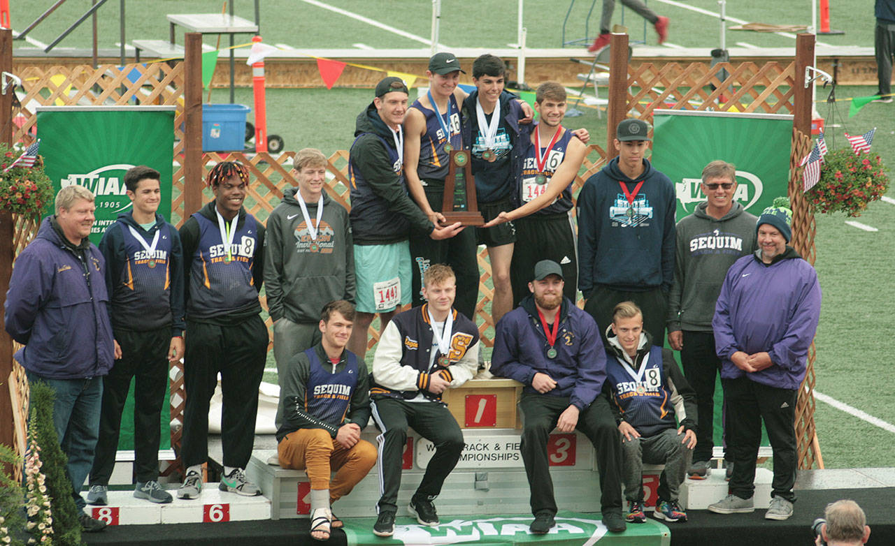 Sequim High School’s boys track & field team celebrates the school’s first track team title at the Class 2A state meet at Mount Tahoma High School in Tacoma on May 25. Photo by Carol Lichten