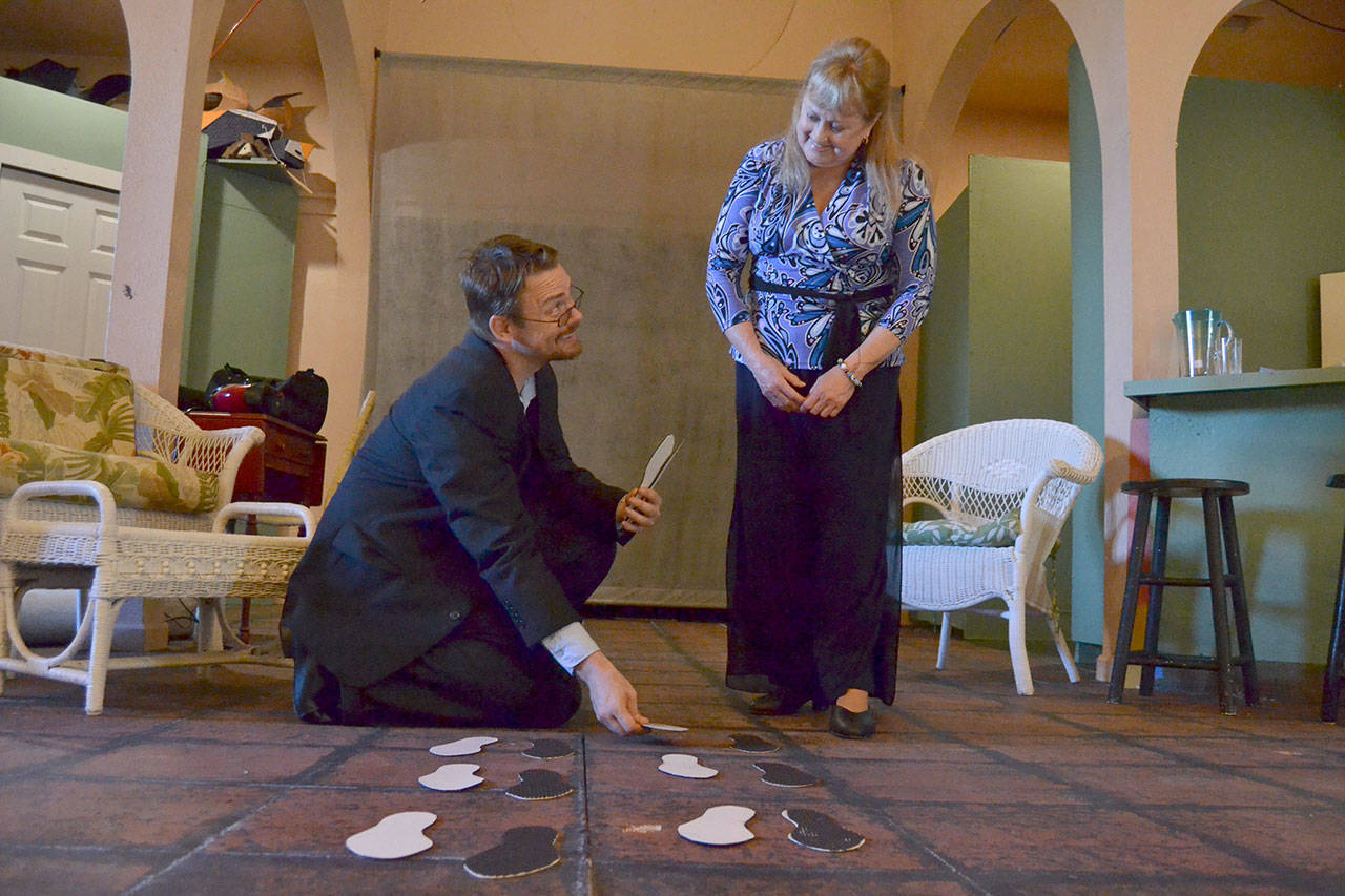 Michael Sickles shows Cheryl DiPietro some steps for OTA’s upcoming show “Six Dance Lessons in Six Weeks.” The pair are the only actors in the show and say it’s been a great experience. Sequim Gazette photo by Matthew Nash