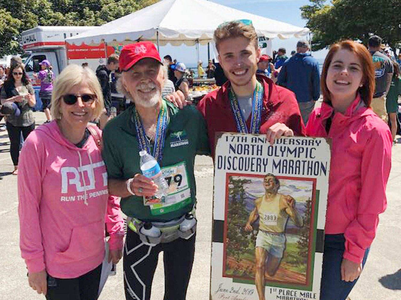 Sequim’s Mikey Cobb, third from left, celebrates a North Olympic Discovery Marathon win on June 2 with family members. They include, from left, parents Trisha and Michael Cobb (who also ran the full marathon) and sister Alison Cobb. Photo courtesy of Michael Cobb