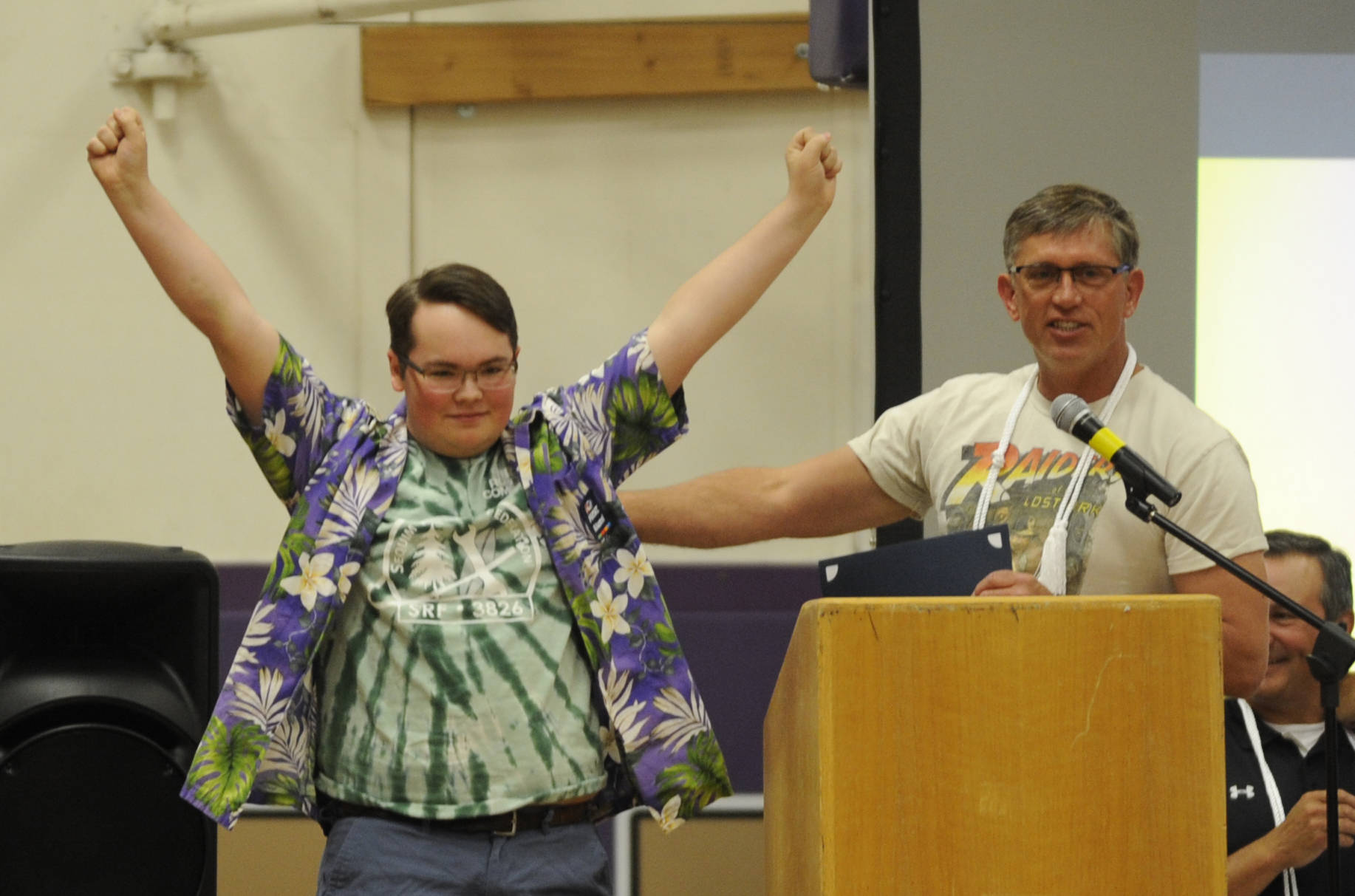 Sequim High senior Ben Logan receives the SHS CTE (career and technical education) award from SHS teacher Brad Moore at a Senior Recognition Assembly on May 31. Sequim Gazette photo by Michael Dashiell
