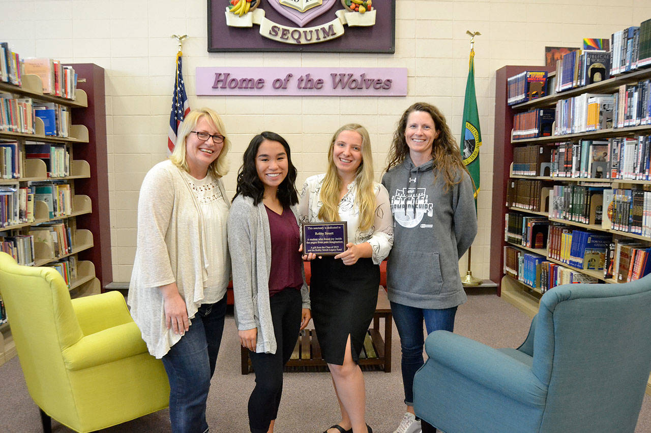 After raising $6,000 for new furnishings under the Robby Streett Legacy Fund, new tables, chairs and coffee tables went into the Sequim High School Library on June 4. There for the installation are, from left, Josslyn Streett, Lesae Pfeffer, Annabelle Armstrong, and Linsay Rapelje, SHS librarian. Sequim Gazette photo by Matthew Nash