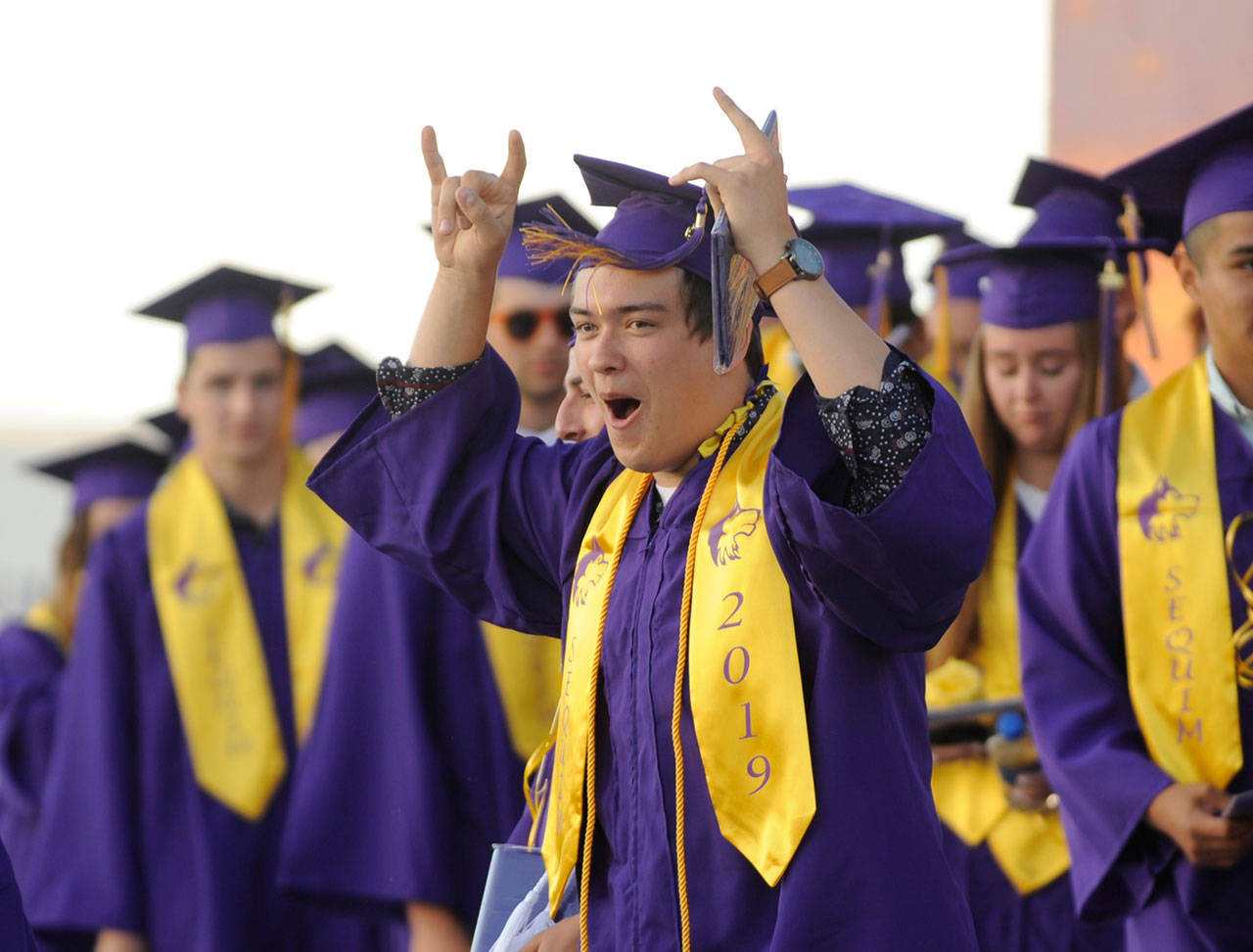 Sequim High graduating senior Tommy Hall lets out a cheer after the SHS commencement ceremony on June 7. More than 180 Sequim High seniors received diplomas this week. Sequim Gazette photo by Michael Dashiell