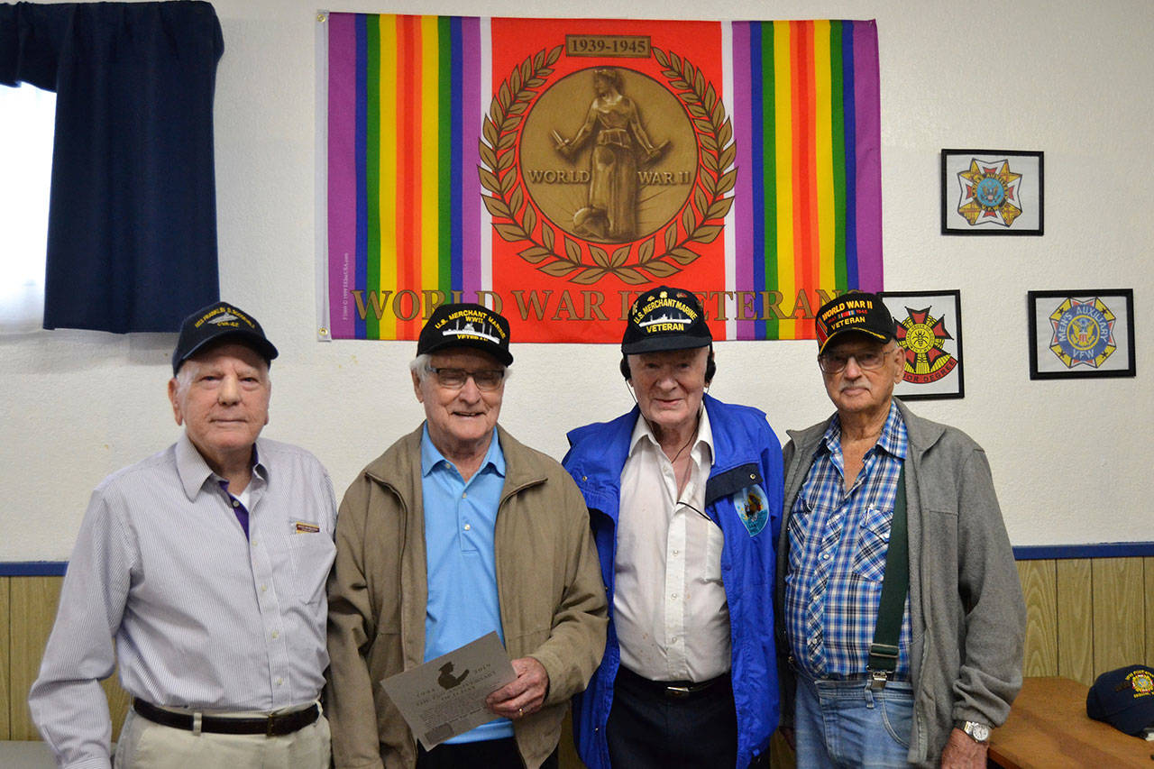 To honor the 75th anniversary of D-Day, four World War II veterans, from left, Claude Giles, Lee Cox, Robert “Bob” Barbee, and Art Bradow, attended the event at the Sequim VFW Post 4760 on June 8. Barbee said hit was the most Merchant Marines the VFW has seen in awhile at once. Sequim Gazette photo by Matthew Nash