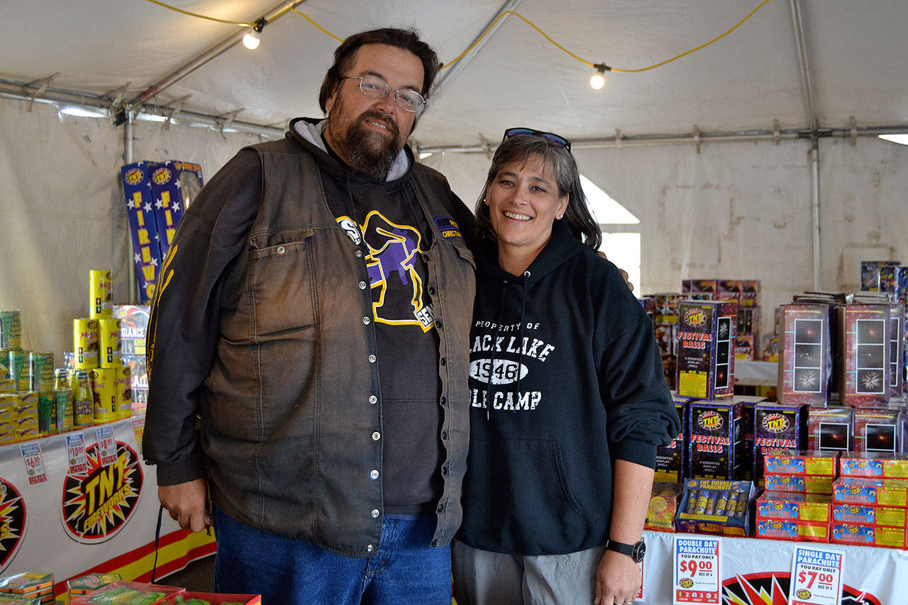 Jonathan and Kenda Simonson continued their tradition this Fourth of July selling fireworks for their Christian ministry the Sequim Vineyard Church. The couple said selling fireworks second to building relationships with the community through the fireworks stand. Sequim Gazette photo by Matthew Nash