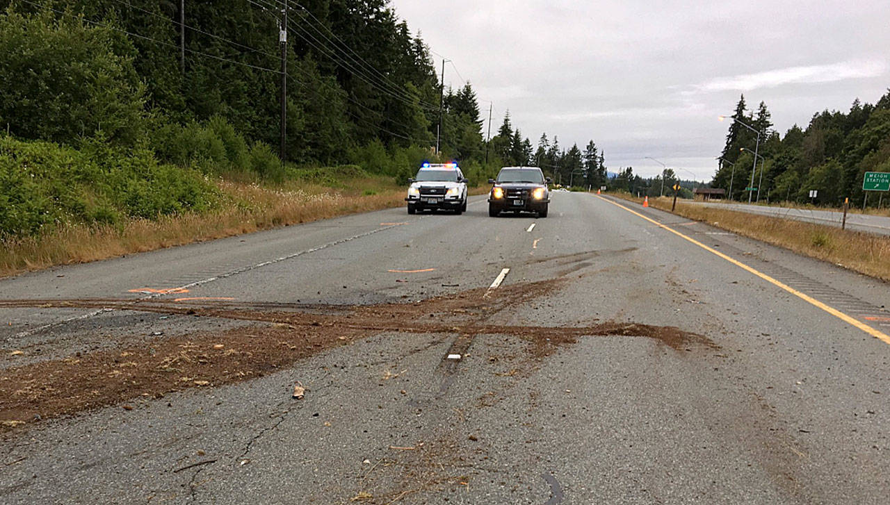 Washington State Patrol troopers respond to the scene of a one-vehicle fatal crash on US Highway 101 just east of Port Angeles on July 5. Washington State Patrol photo