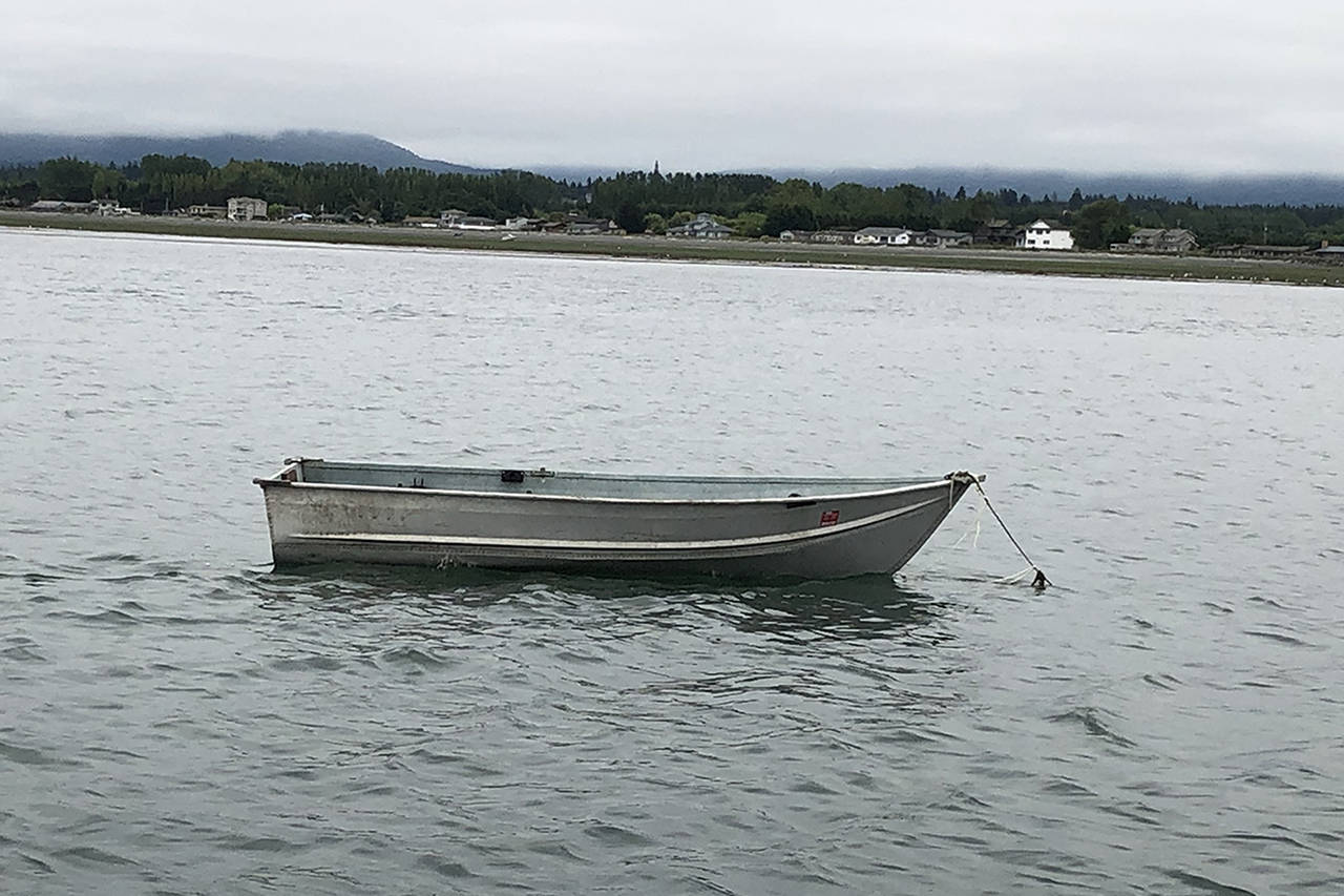 After falling from this small aluminum dinghy, a man was rescued by John Robert Labbe and his family and Sue Cram and Dick Neil in Dungeness Bay on July 4. The boat also had a small outboard motor that Labbe detached and stowed away to make it safer and easier to transport back to John Wayne Marina. Submitted photo by Dick Neil