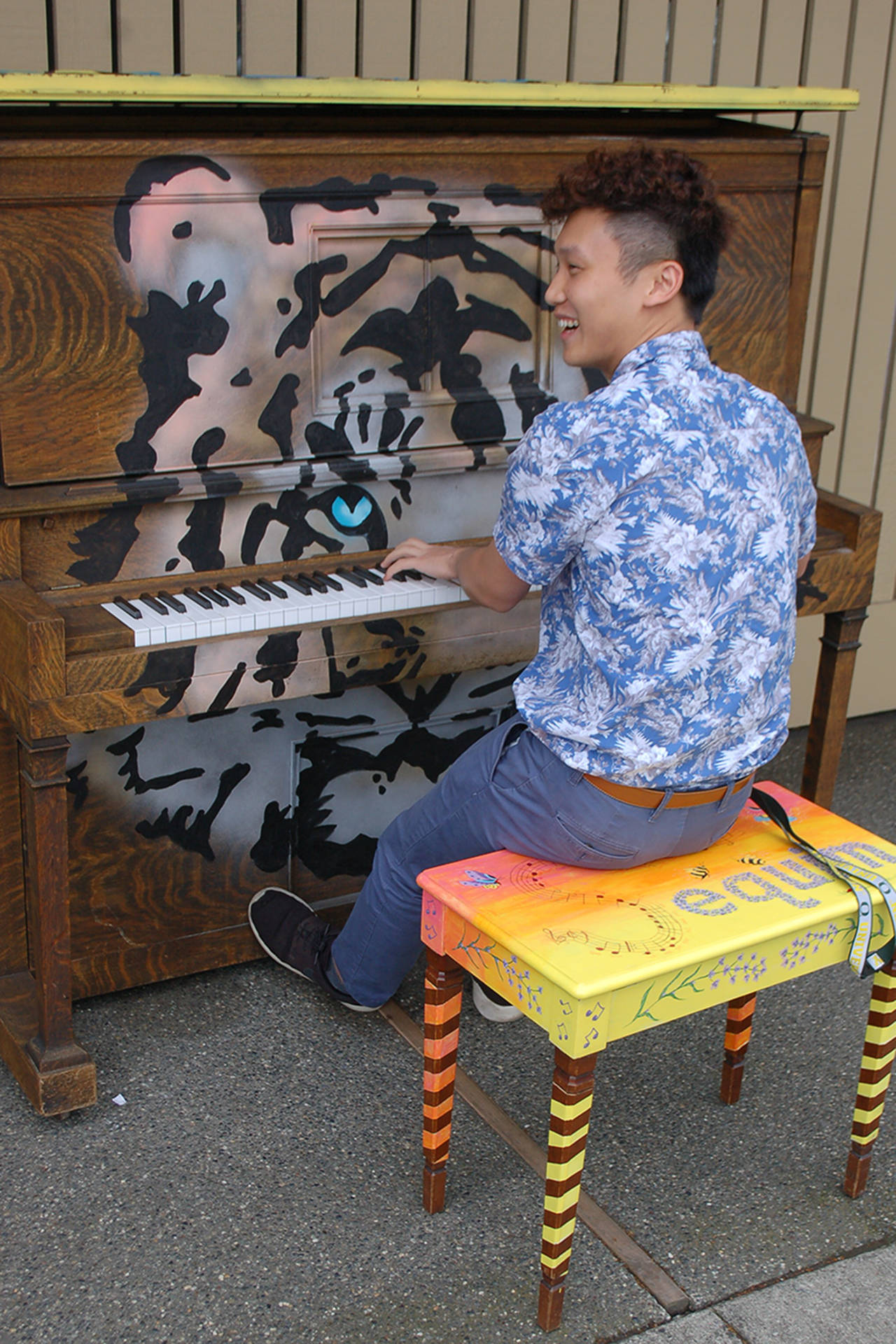 Anson Ka-lik Sin plays a Scarlatti sonata on the community piano placed in front of US Bank at the corner of Washington Street and Sequim Avenue. A Hong Kong native and former Peninsula College student, Sin still enjoys coming to Sequim to play and perform. Sequim Gazette photo by Conor Dowley.