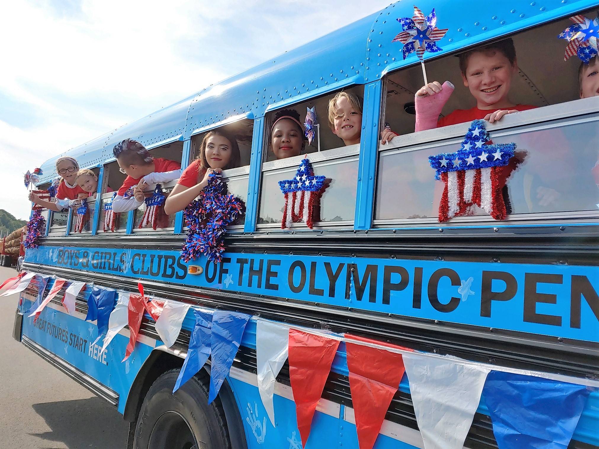 Big Blue, the Boys & Girls Clubs of the Olympic Peninsula bus, took Club members through Port Angeles’ Fourth of July parade this year. Submitted photos