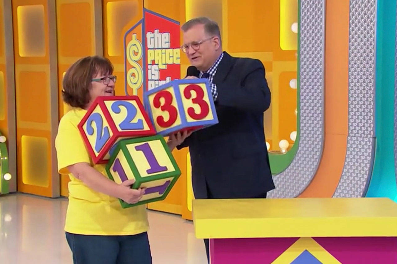 Sequim’s Kathy Conrad attempts to price items according to cost with host Drew Carey on “The Price is Right.” One item she won included a ping pong table, which she donated to the Sequim Boys & Girls Club. Submitted photo