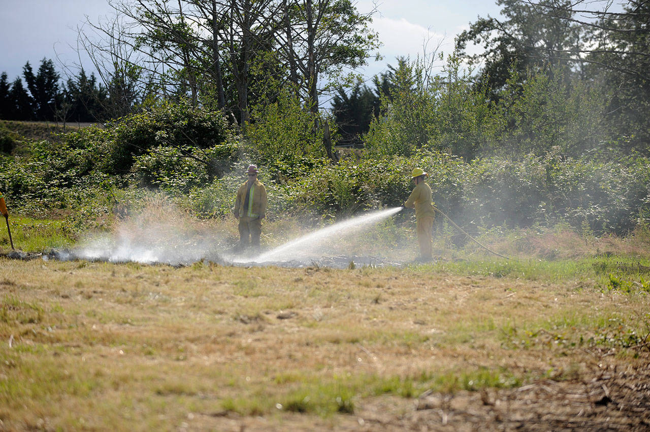 Recent rains helped prevent a brush fire from spreading more on July 19, firefighters with Clallam County Fire District 3 said. Sequim Gazette photo by Matthew Nash