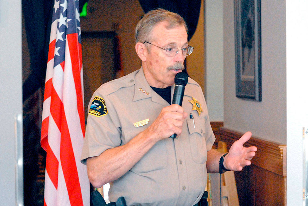 Clallam County Sheriff Bill Benedict speaks during a luncheon meeting with the Kiwanis Club of Port Angeles last week that he’s spending an amount equal to about 0.5 full-time equivalents to conduct annual background checks for owners of firearms Photo by Keith Thorpe/Olympic Peninsula News Group