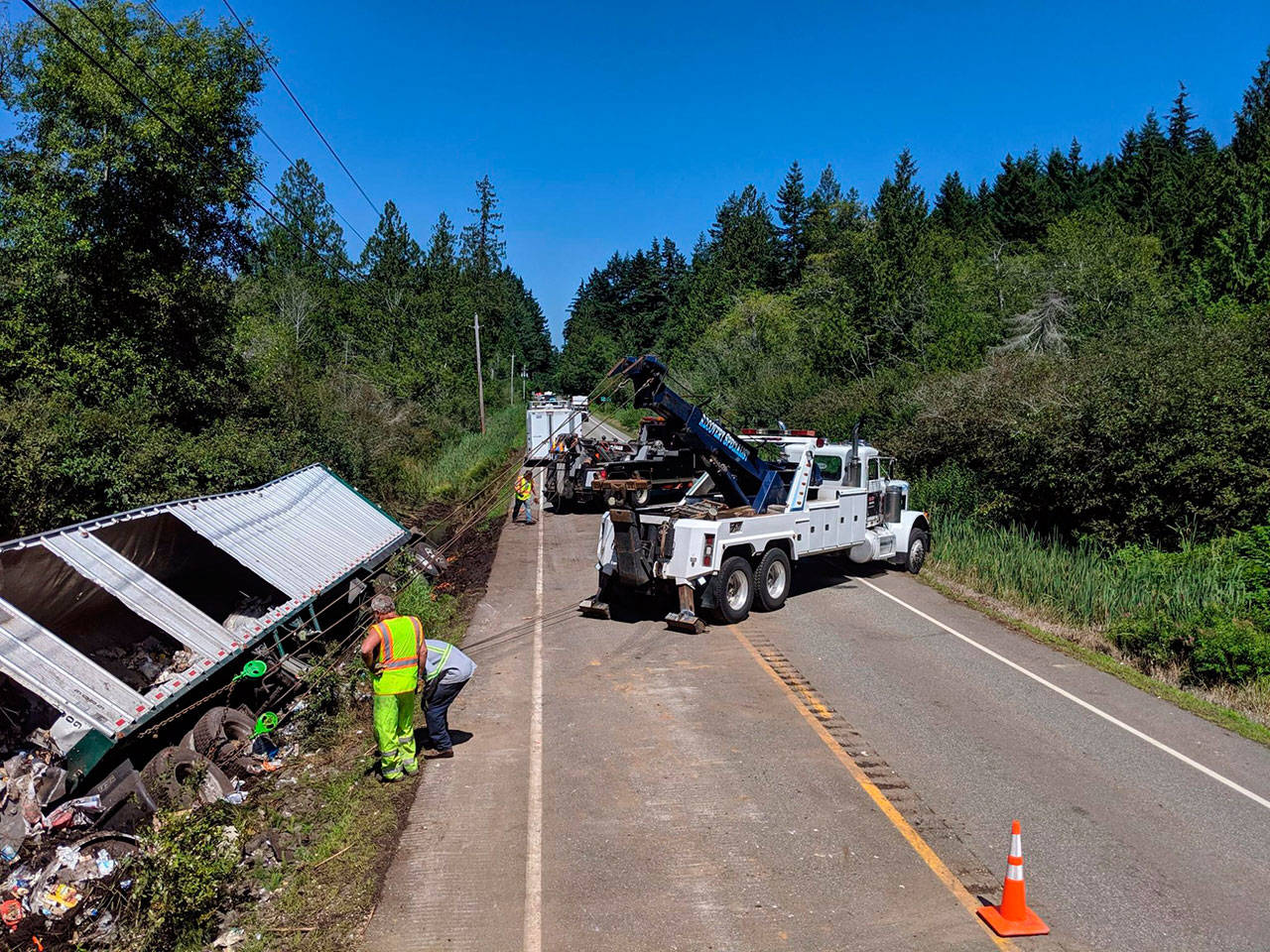 Road crews worked more than 12 hours to clear this trailer wreck that involved a Sequim man who was taken to Harborview Medical Center. Photo courtesy of Washington State Patrol
