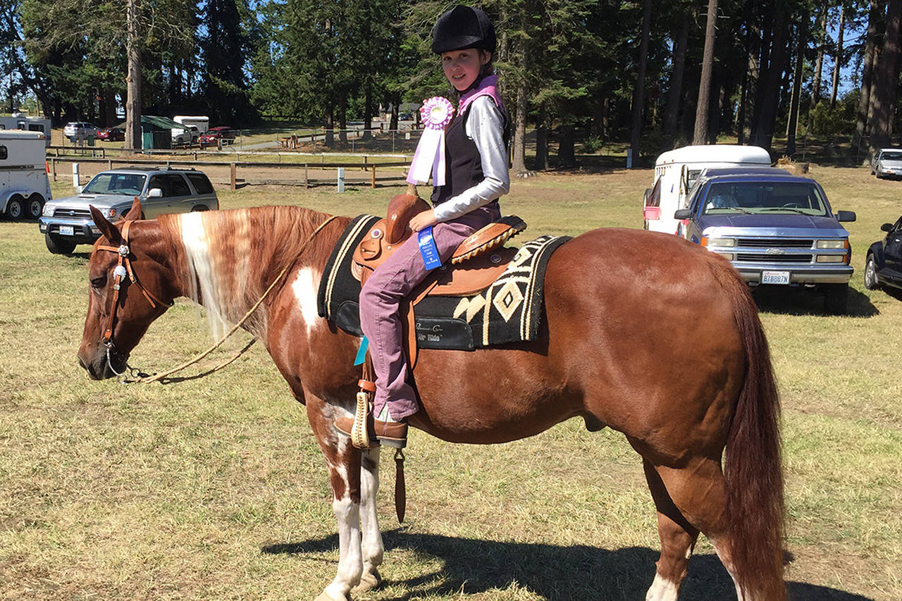 Katelynn Sharpe on her horse Rip It Up after winning a championship in Western Pleasure Walk Jog at the 4-H horse show at the Clallam County Fairgrounds on July 20. Photo submitted.