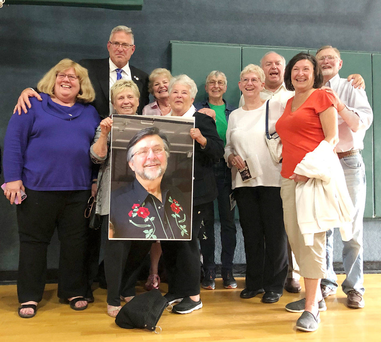 Taking part in a Celebration of Life for Billy Nagler (in held picture) recently are club board members, from left, Pat McCauley, Tom Baermann, Dee Christensen, Carol Rutledge, Sherry Phillips, Isabelle Dunlap, Gini Hawe, Joe Hawe, Cathy Carl and Bryce Fish. Submitted photo