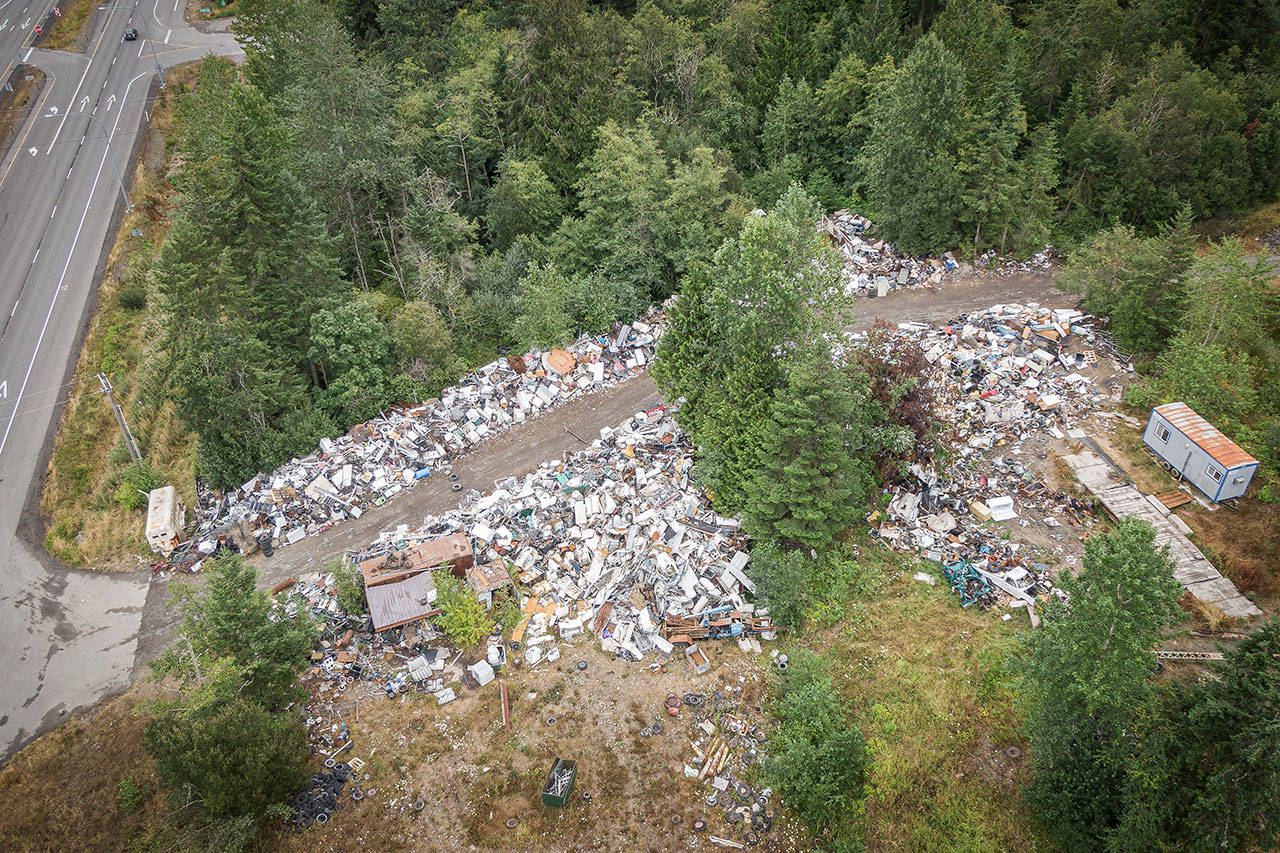 Midway Metals at 258010 U.S. Highway 101 is shown in this aerial photo. Clallam County is exploring ways to get the scrapyard property cleaned up. Photo by Dave Pitman/Olympic Aerial Solutions