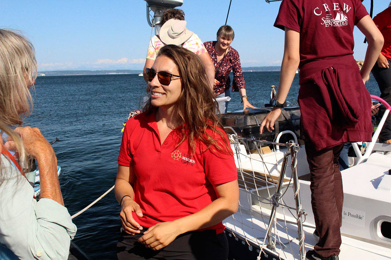Mackenzie Marmol, a Sequim resident and Sequim High graduate, helps the public board and tour the Maiden last week in Port Townsend. The Maiden, a 58-foot aluminum-hulled racing yacht, made history in the 1989-1990 Whitbread Round the World Race when it set sail with a completely female crew led by Tracy Edwards. It was the first all-female crew to compete in the race and it won second in its class. The Maiden was refurbished four years ago when it was found abandoned, and it sails again with an all-female crew with members from all over the world. Now it is circumnavigating the world again. Marmol is a guest crew member until it reaches San Francisco this week. Photo by Zach Jablonski/Peninsula Daily News