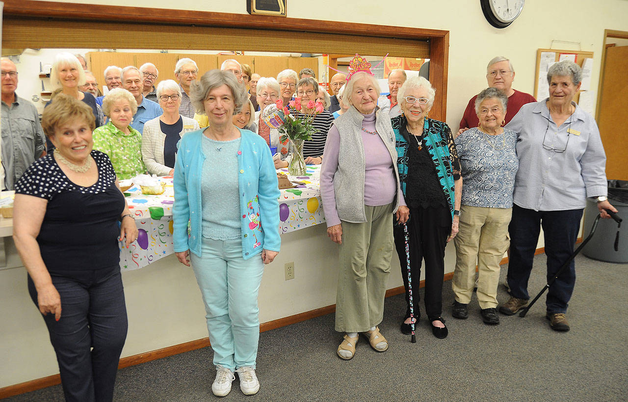 Betty Longshore (in front, third from left) celebrates turning 100 with members of her Sequim Duplicate Bridge Club last week. The club meets Mondays and Fridays with games starting at 12:30 p.m., at the Masonic Lodge, 700 South Fifth Ave. Sequim Gazette photo by Michael Dashiell