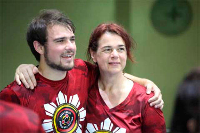 Sam Manders and Kathrin Sumpter look on as results are announced at the Cacoy Cañete Doce Pares World Invitational Tournament & Gathering in Cebu City, Philippines. Photo courtesy of Kathrin Sumpter