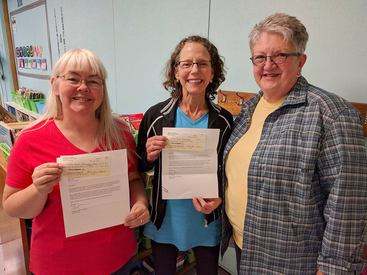 The Beta Nu Chapter of Delta Kappa Gamma recently awarded two grants to help students at Helen Haller Elementary. Pictured, from left, are reading paraeducator Rhonda Cays, reading specialist Betsy Smith and Beta Nu representative Louise Potter. Submitted photo