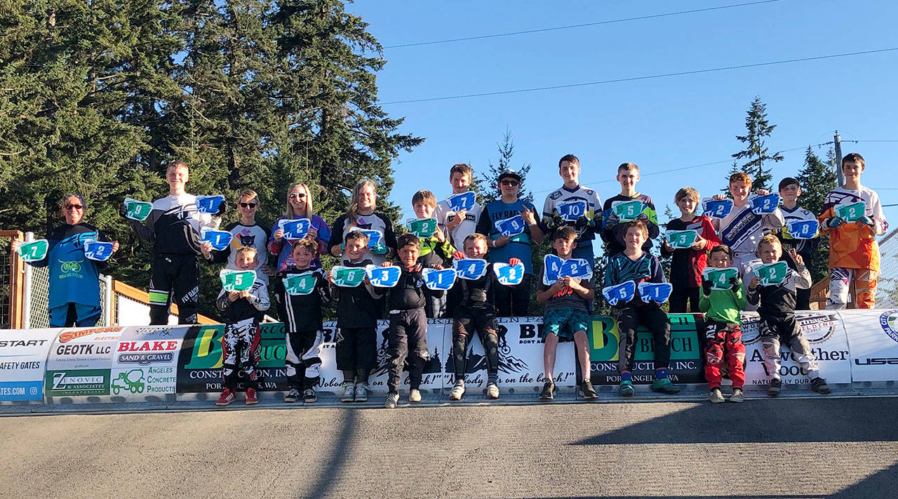 A slew of local BMXers celebrate state titles and show off their championship plates in mid-August at Lincoln Park. They include (back row, from left) Aaron Edwards, 51 and Over Intermediate (#7) and 56-60 Cruiser (#2); Isaiah Muckley, 15 Novice ((#9)) and 15 Cruiser (#1); Iris Winslow, 51-55 Female Cruiser (#1); Shellie Belbin, 46-50 Female Cruiser (#2); Catherine Copass, 46-50 Cruiser (#1); Zephyr Thompson, 10 Intermediate (#2); Colby Groves, 15 Expert (#7); Andy Goldsbary, 14 Expert (#9); Joseph Pinell, 15 Expert (#10); Mason Beal, 14 Intermediate (#5); Jackson Beal, 12 Intermediate (#2); Brian Belbin, 12 Expert (#2) and 12 Cruiser (#2); Zachery Pinell, 13 Expert (#8) and Chase Schweitzer, 15 Intermediate (#2), with (front row, from left) Atticus Reed, 5 and Under Novice (#5); Danny Goettling, 5 and Under Intermediate (#4); Dominc Casebolt, 7 Intermediate (#6); Evan Hernandez, 6 Expert (#1) and 7 and Under Cruiser (#3); Ethan Barbre, 9 Expert (#4) and 9 Cruiser (#2); Cash Coleman, 13 Expert (#4) and 13 Cruiser (#2); Anthony Jones, 11 Expert (#5) and 11 Cruiser (#1); Maverick Williams, 8 Novice (#4), Thomas Dalgardno, 6 Intermediate (#2). Not pictured are state plate winners Anthony Brigandi (14 Intermediate, #7), Natale Brigandi (12 Novice, #9), Taylor Coleman (15-16 Girl Expert, #3, and 15-16 Female Cruiser, #2), Cory Cooke (17-20 Expert, #4, and 17-20 Cruiser, #2), and Piper Williams (14 Novice, #6). Submitted photo