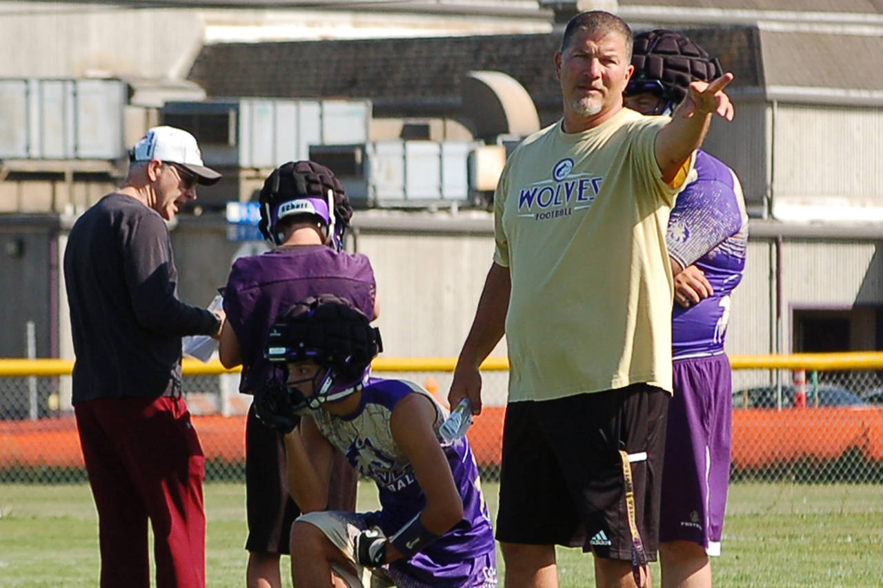 Head coach Erik Wiker gives instructions to his team during a summer practice. “I think this can be another really good season,” the longtime Wolves coach said. “We’ve got some challenges and changes, but this is a good team.” Sequim Gazette photo by Conor Dowley