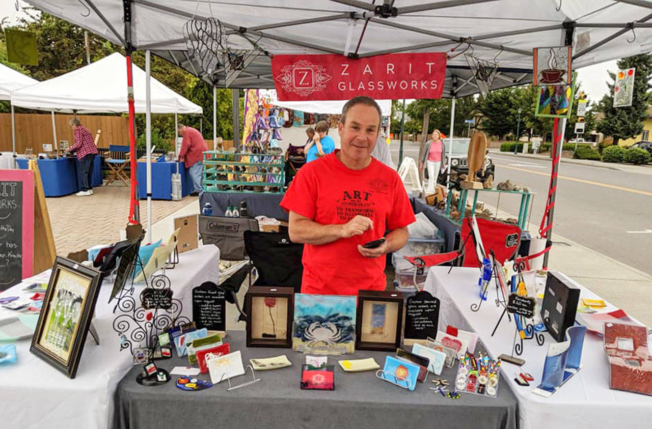 Steve Zarit displays wares at the Zarit Glassworks booth. Photo courtesy of April Hammerand/Sequim Farmers Market