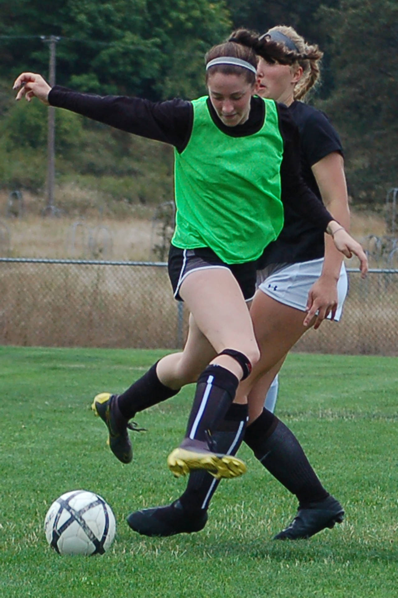 Wolves midfielder Abby Schroeder, front, works past defender Gabby Happe during a possession drill at a recent girls soccer practice. “Abby has the ability to be a really important player in this team,” head coach Derek Vander Velde said. Sequim Gazette photo by Conor Dowley