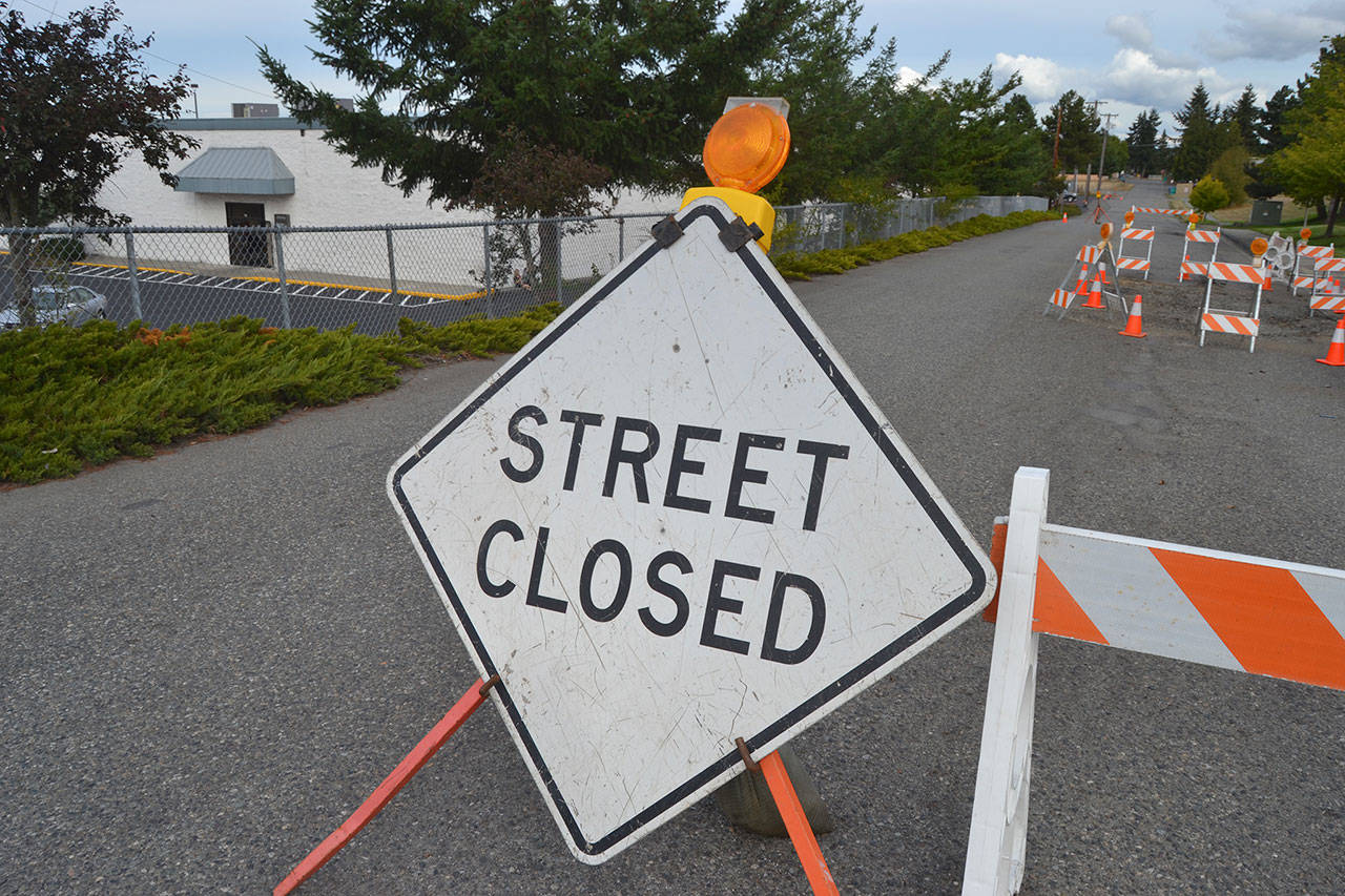 A portion of Maple Street between South Seventh and South Sixth Avenue remains closed until construction repairs begin in October to repave the road along with a few other portions of city streets on the eastern side of the City of Sequim. City staff said a water line broke on Maple Street causing the damage to the road. Sequim Gazette photo by Matthew Nash