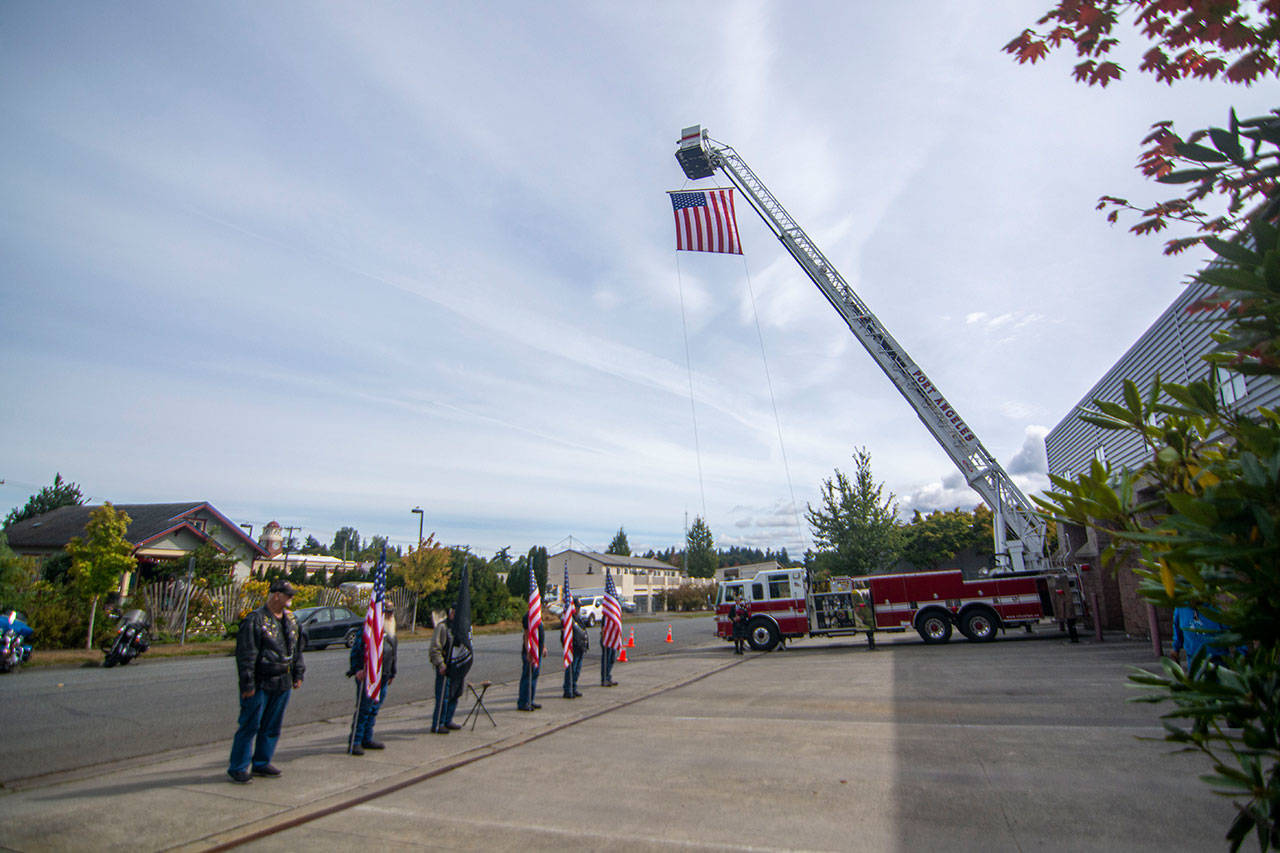 American Legion Riders present colors at the Port Angeles Fire Department on the 18th anniversary of the 9/11 terrorist attacks Wednesday. (Jesse Major/Peninsula Daily News)