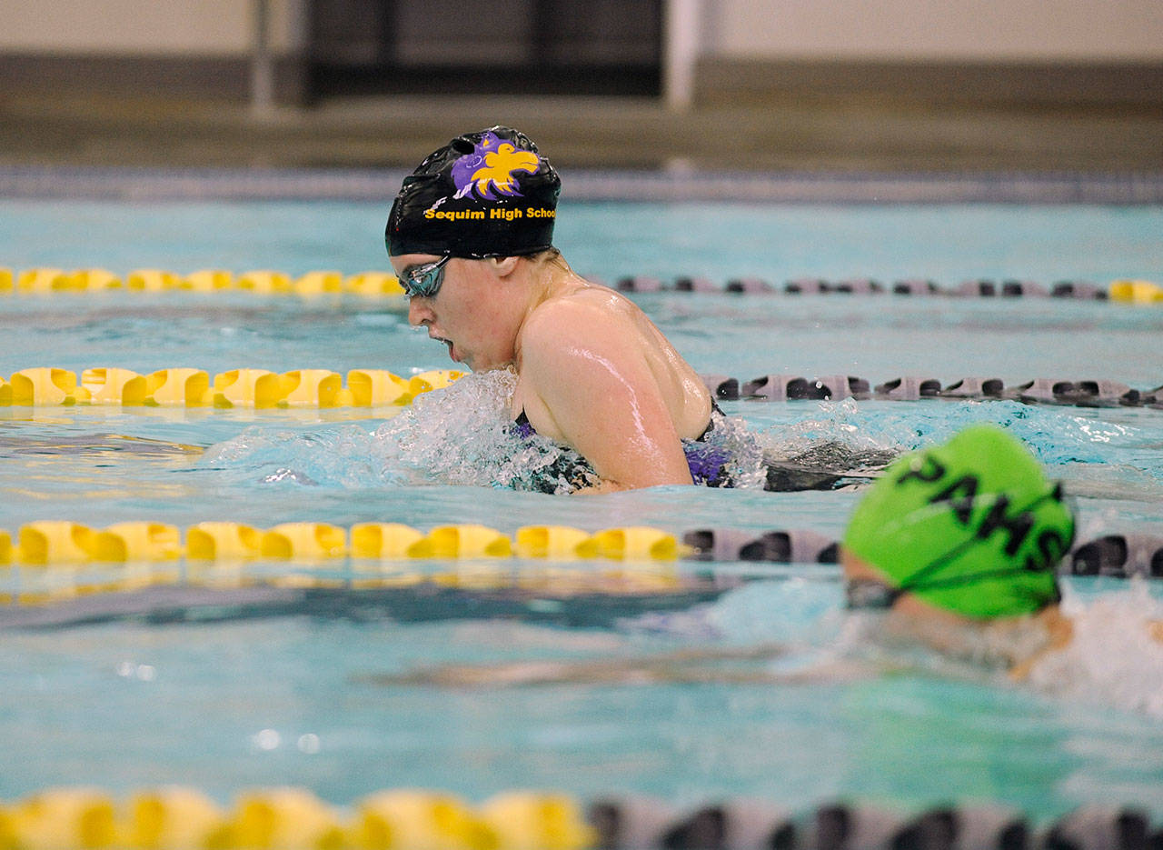 Sydney Swanson races to a close win — by .35 of a second — in the 100 breaststroke in Sequim’s home meet against Port Angeles on Sept. 19. Swanson posted a district qualifying time (1:20.43) in the event. Sequim Gazette photo by Michael Dashiell