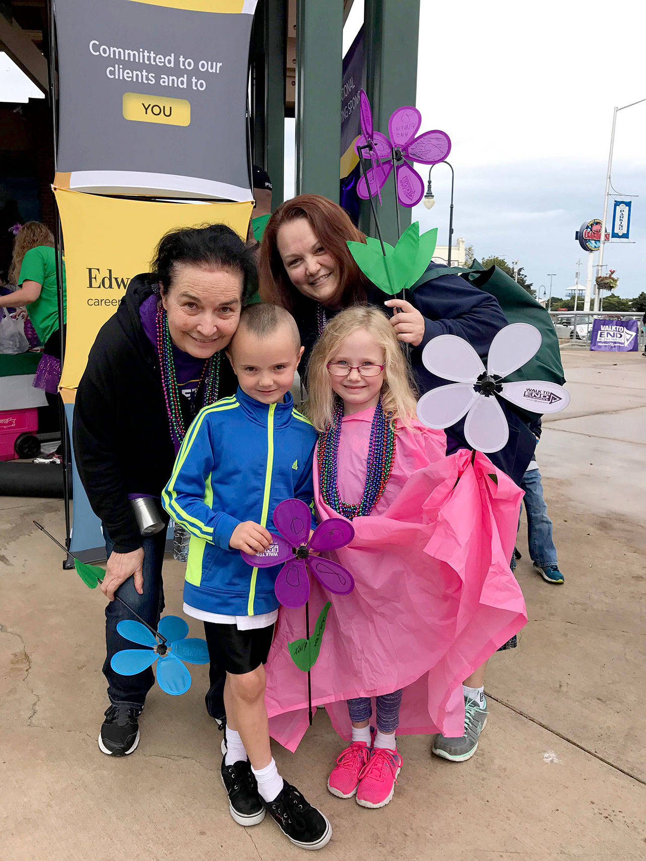 Michele Devlin of Sequim, pictured here with her mother Debi Turner and her twin children, will be participating in the North Olympic Peninsula Walk to End Alzheimer’s for the third year in a row. She walks in honor of her mom, Debi Turner, who lost her battle with Alzheimer’s disease and breast cancer in December 2018. Submitted photo