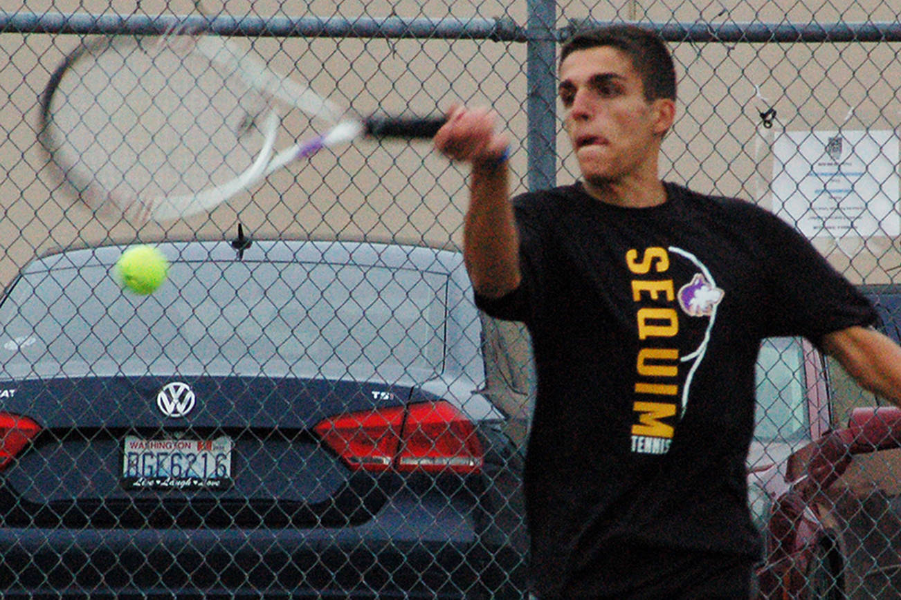 Nico Zingaro returns a serve in the second set of his match against North Kitsap’s Chris Schuchart on Sept. 25, which he would win 6-2 to win the match. Zingaro was Sequim’s only undefeated player on the week, not dropping a single set in three matches. Sequim Gazette photo by Conor Dowley