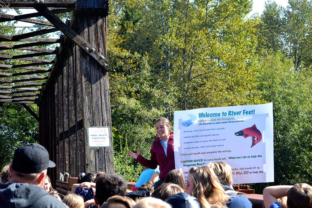 Jenna Ziogas, education coordinator for the Dungeness River Audubon Center, welcomes Greywolf Elementary fifth graders atop the Railroad Bridge as they ready to go to the Dungeness River Festival on Sept. 27. Sequim Gazette photos by Matthew Nash