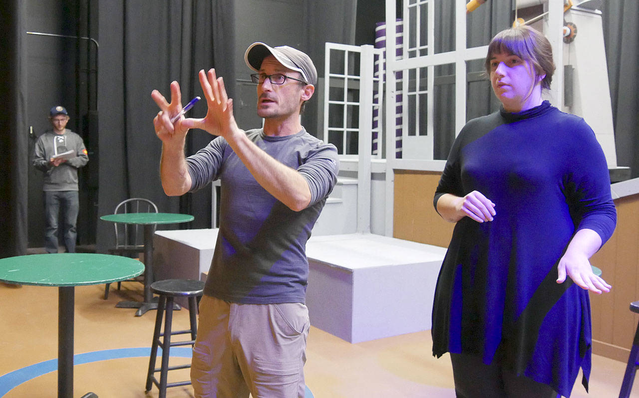Director Josh Sutcliffe, center, works on presence with actor Ginny Holladay Jesse, with cast member Matt Forrest in the background, during a rehearsal for “Silent Sky.” Photo courtesy of Olympic Theatre Arts