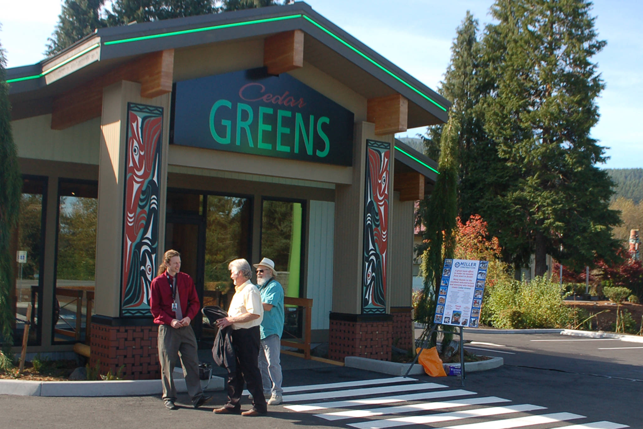Cedar Greens general operations manager Mike Smith, left, speaks with two attendees of the grand opening for the Jamestown S’Klallam Tribe’s new cannabis dispensary store. Sequim Gazette photo by Conor Dowley